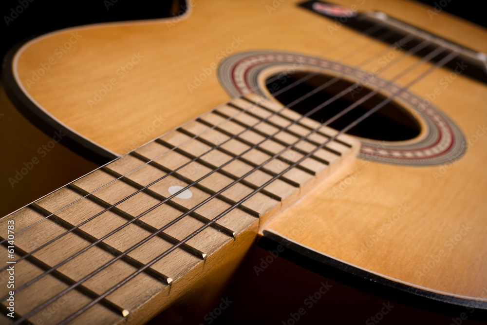 Close-up of classic acoustic guitar. Shallow DOF.. Close-up of classic acoustic guitar. Shallow DOF..