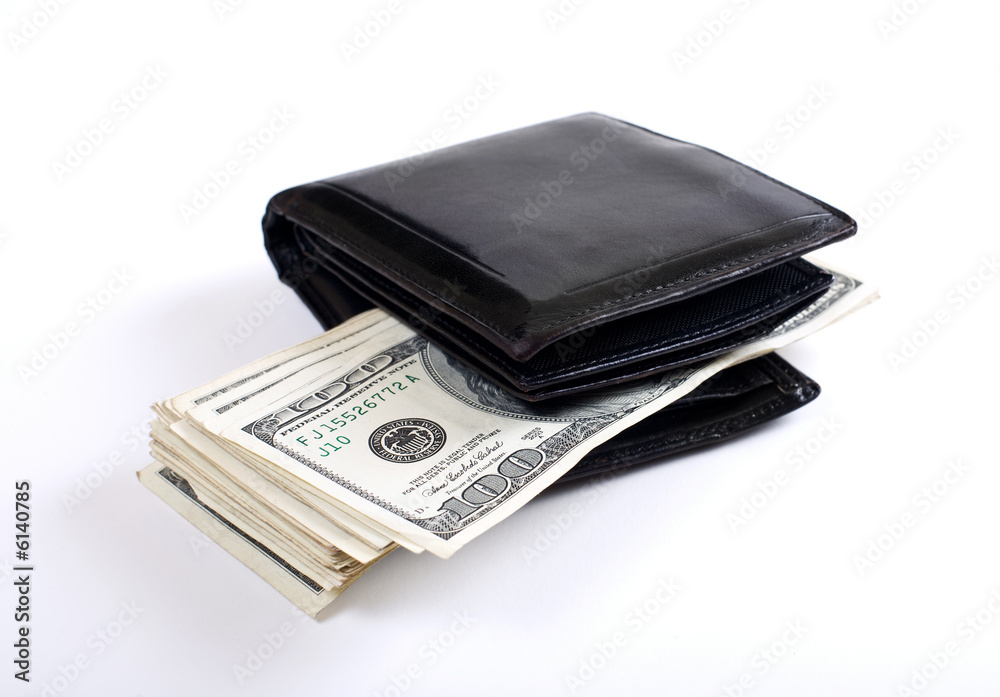 Money sticking out from wallet. White background. Shallow DOF.. Money sticking out from wallet. White background. Shallow DOF..