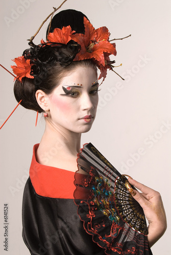 The young Japanese woman on a grey background