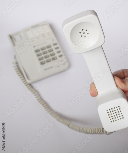 Hand with telephone reciever photo