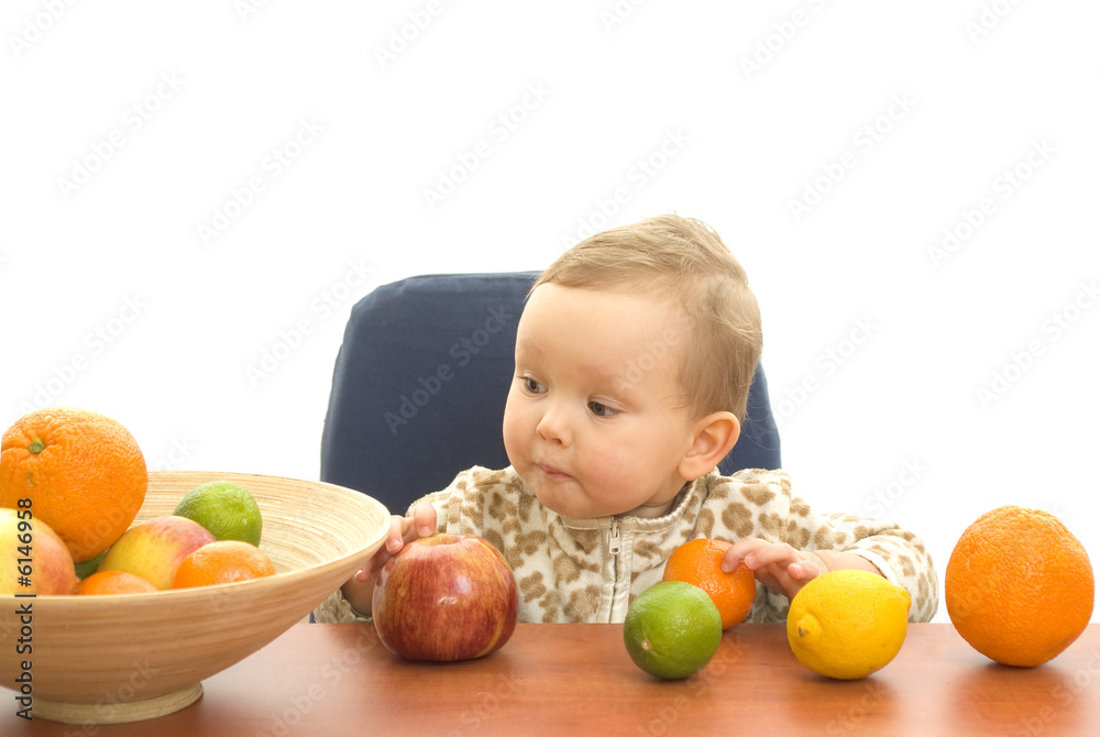 Fototapeta premium Baby and fresh fruits on table isolated background