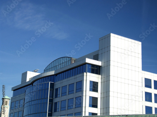 White Office Building against a blue sky.