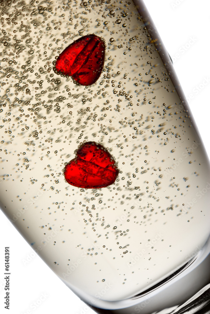Fototapeta premium Two hearts in champagne.