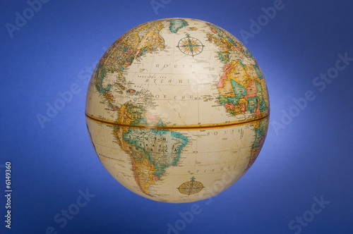 a globe of the earth against a blue background