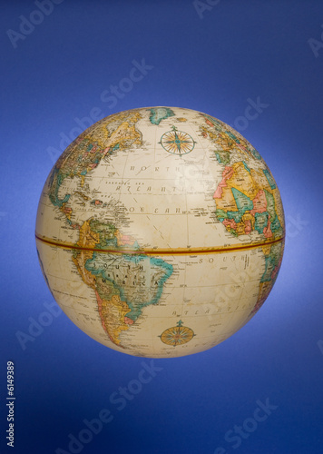 a globe of the earth against a blue background