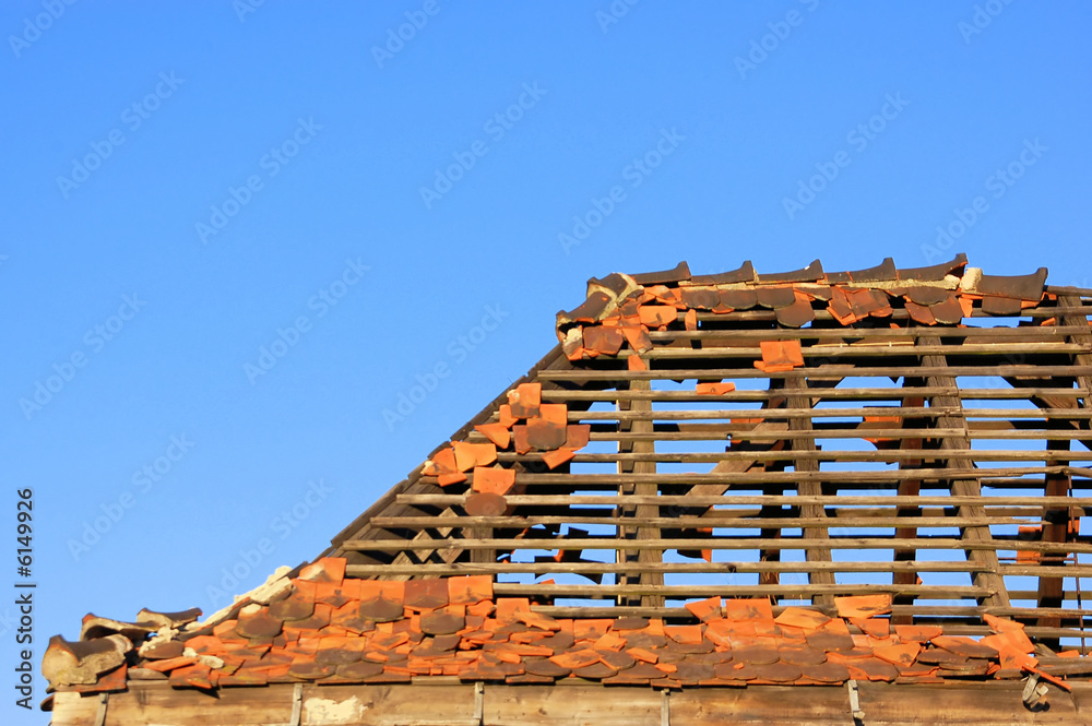Old roof with a lot of missing tiles Old roof with a lot of missing tiles