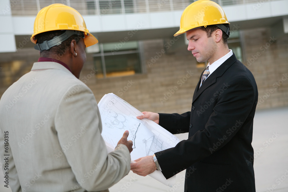 Handsome men working on a construction site Handsome men working on a construction site