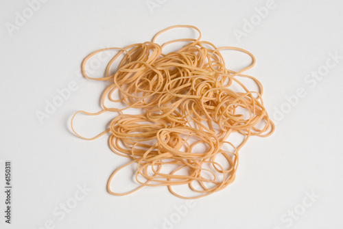 a pattern of rubber bands on a white seamless background