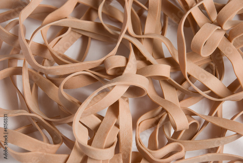 a pattern of rubber bands on a white seamless background