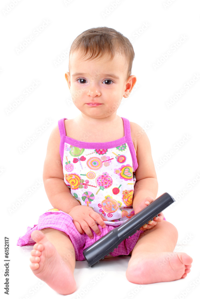 Baby with remote control watching drama movie. Baby with remote control watching drama movie.