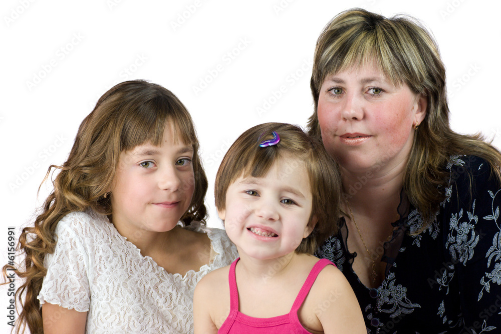 Mother with two daughters posing together isolated on white Mother with two daughters posing together isolated on white