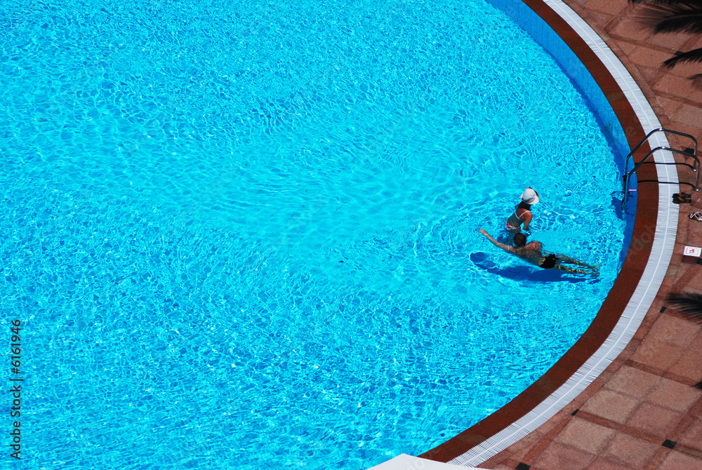 Couple in tropical pool