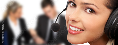Smiling  pretty business woman with headset. .