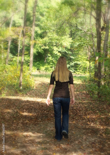 woman walking in the forest