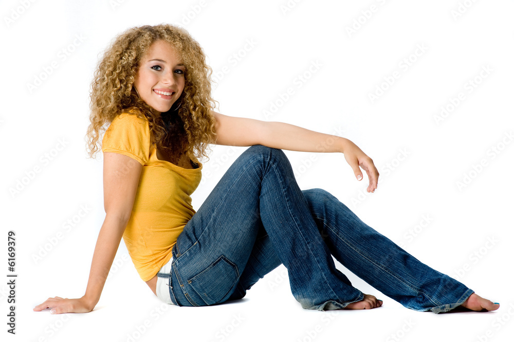 A happy teenage girl with curly hair on white background A happy teenage girl with curly hair on white background