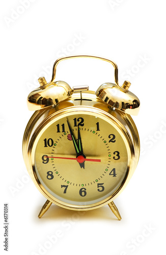 Golden alarm clock isolated on the white