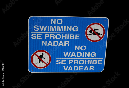 Bilingual no swimming sign photo
