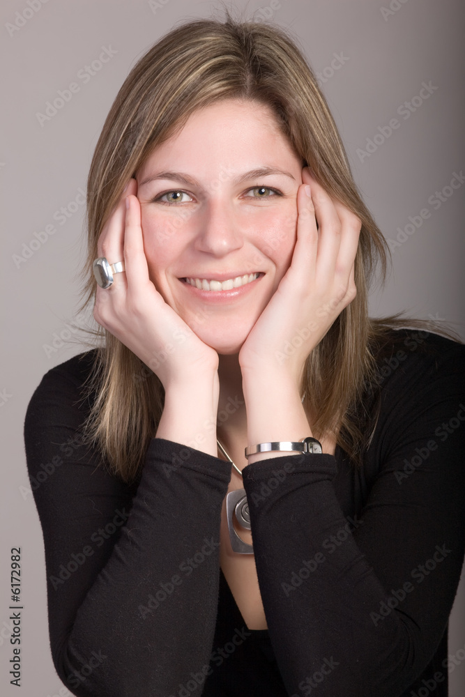 portrait of beautiful blond woman smiling on grey background portrait of beautiful blond woman smiling on grey background