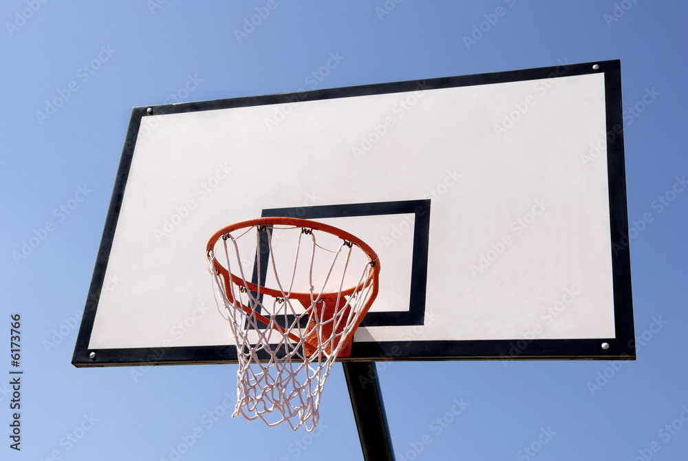 Outdoor basketball hoop against the blue sky