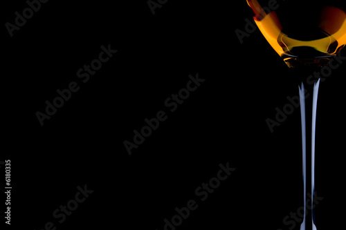 full wine glass on the black background