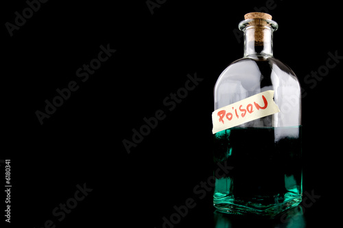huge bottle with green poison on black