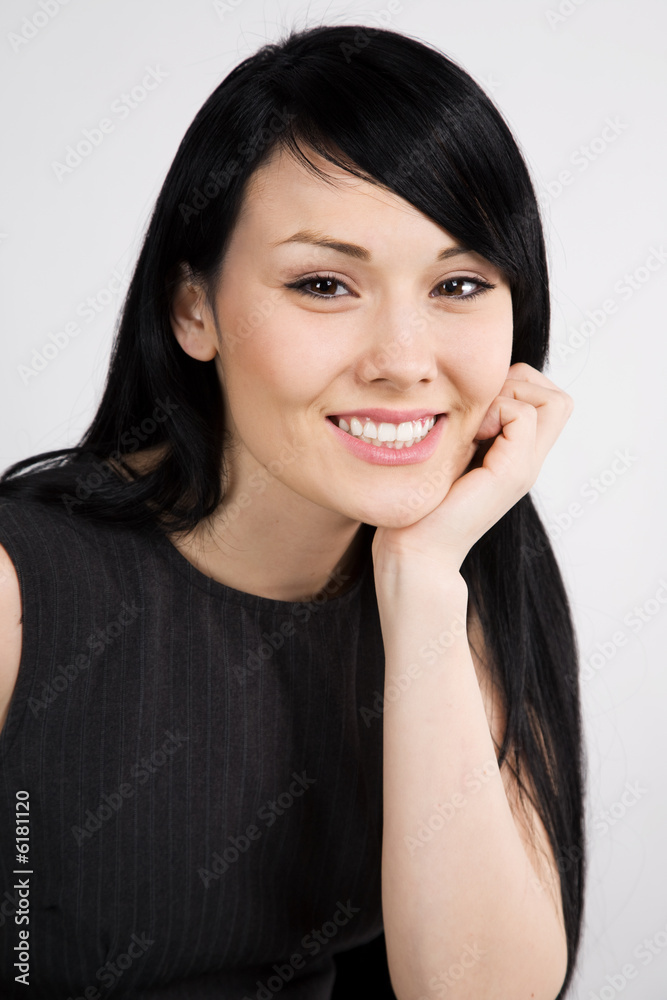 A headshot of a beautiful smiling businesswoman