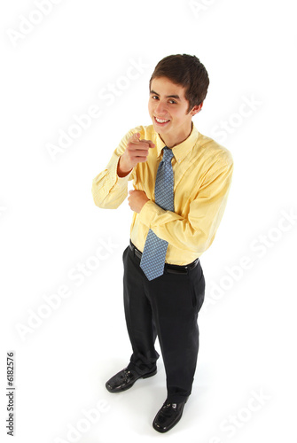 A teen businessman pointing at camera.