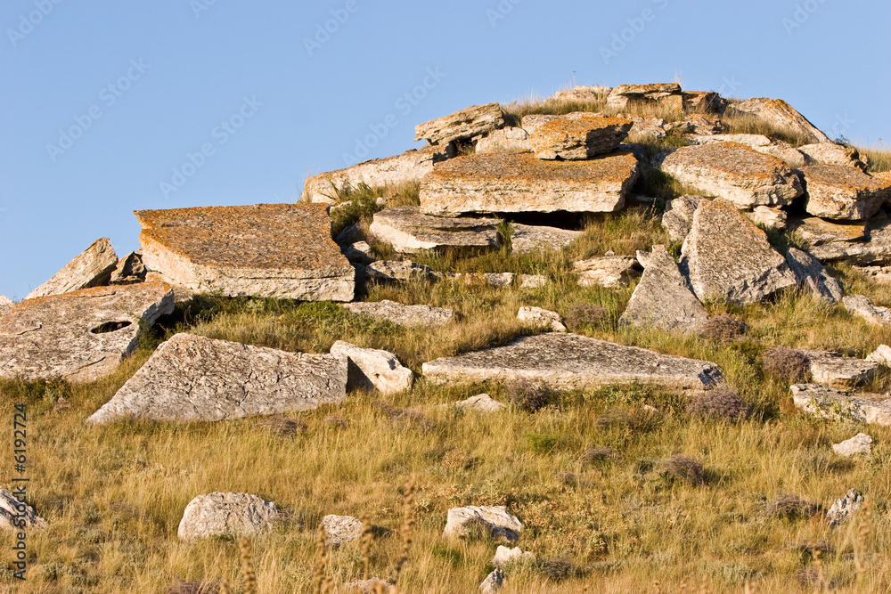 landscape series: stone hill among dry grass