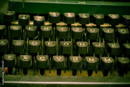 Old dusty typewriter keyboard. author and copyright concept