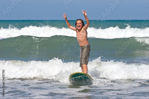 Photography A young caucasian male learns to surf