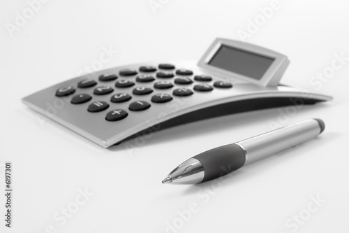 Pen and calculator (business background)