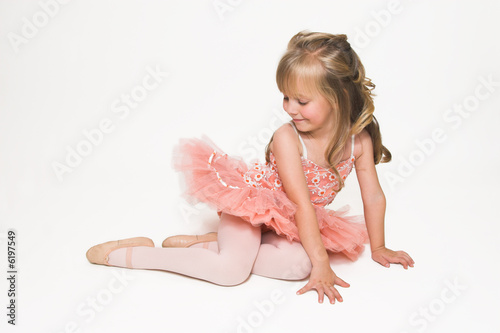 Young ballet dancer wearing an apricot tutu