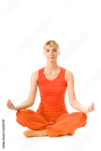 Beautiful young woman doing yoga exercise 