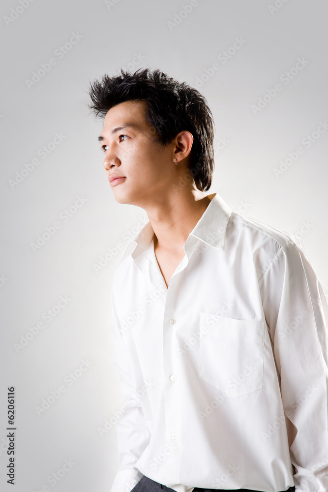 young man look up thinking with white shirt