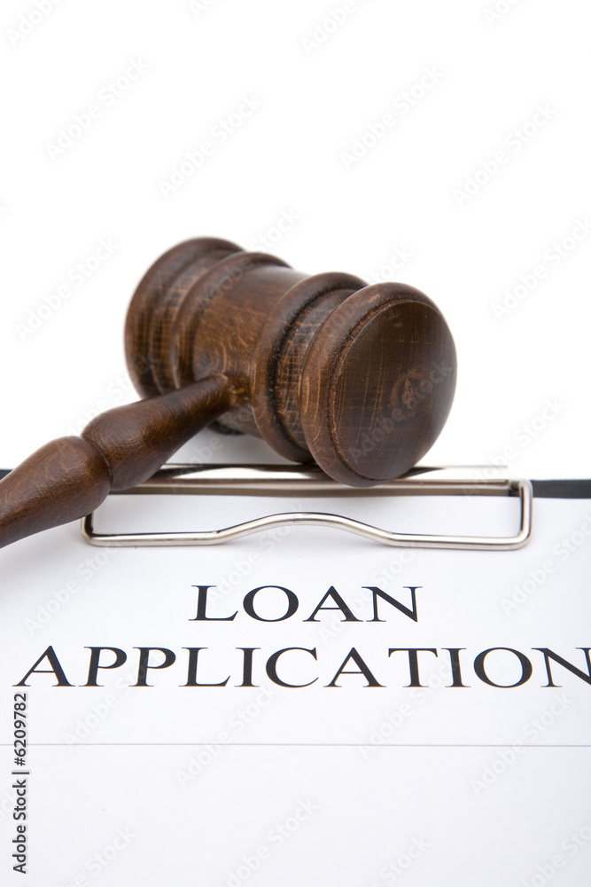 business concept with loan application form and gavel