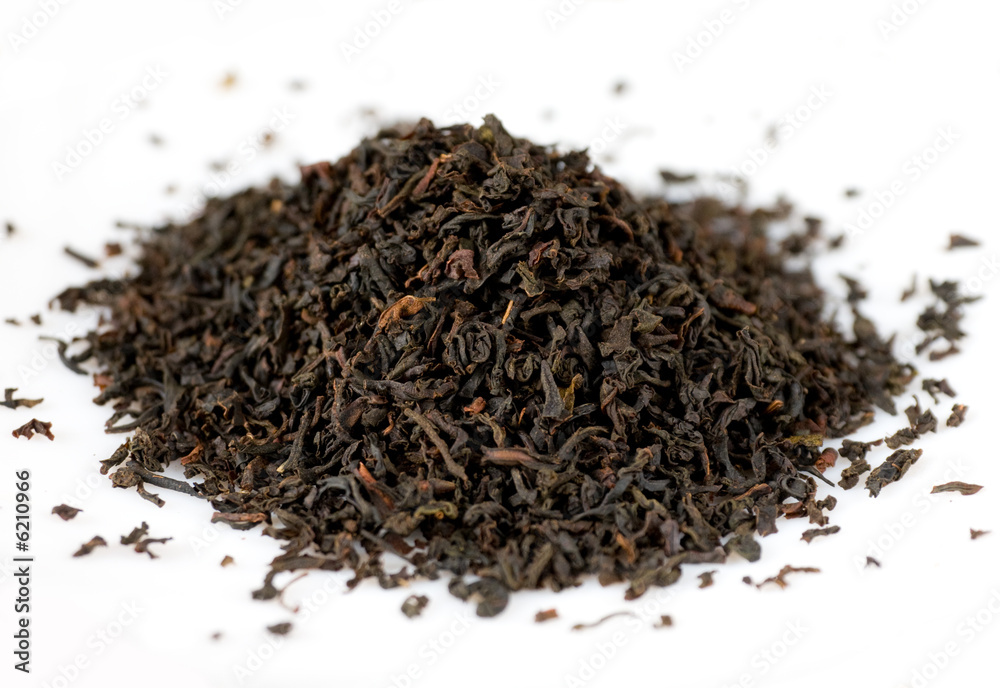 Handful of black tea leaves on white background Handful of black tea leaves on white background