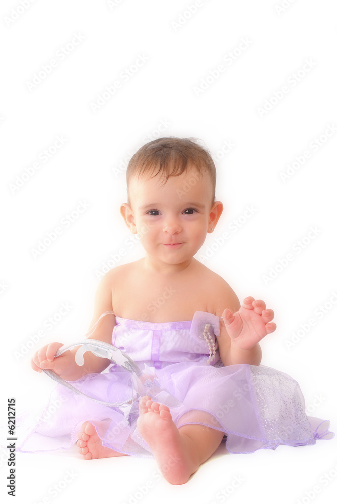 A baby girl in a fairy dress, wearing a crown, white background. A baby girl in a fairy dress, wearing a crown, white background.