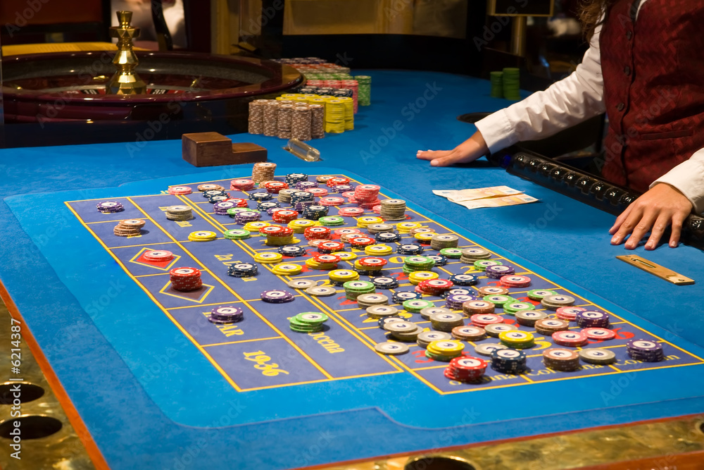 Fototapeta premium croupier preparing and counting money on roulette casino