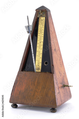 Classic old  metronome isolated on white background