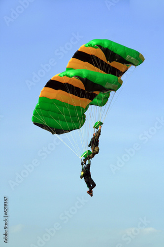 two skydivers in cascade formation before final landing photo