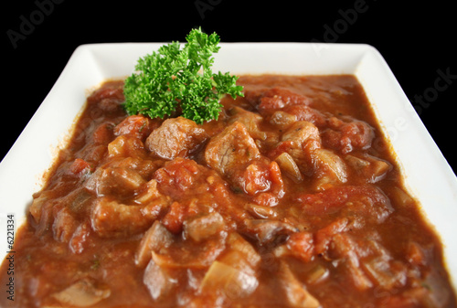 Delicious beef and red wine casserole ready to serve. © jabiru