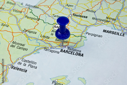 Blue pin pointing on barcelona in europe map