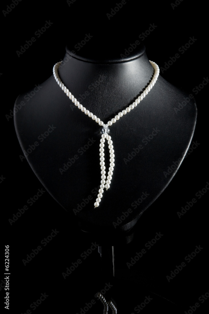 Necklace from pearls on a black background. Necklace from pearls on a black background.