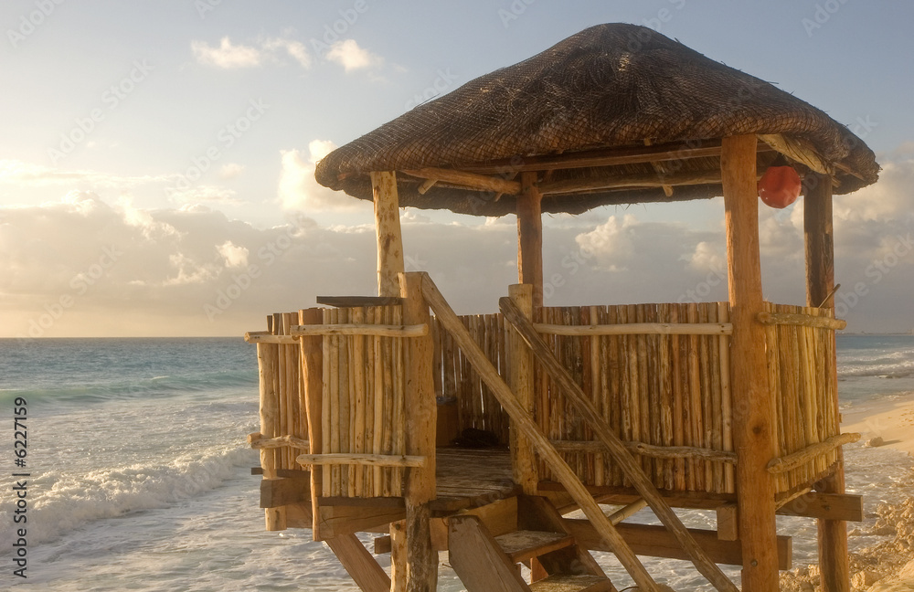 Fototapeta premium A bamboo and straw lifeguard hut on the beach