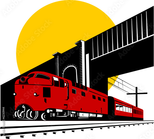 Diesel train passing under bridge
