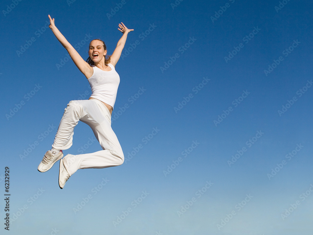 happy smiling successful woman jumping with joy happy smiling successful woman jumping with joy