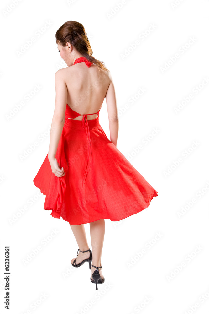 woman in red dress turn around while walking woman in red dress turn around while walking