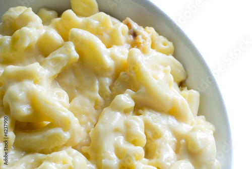 macaroni and cheese macro in bowl with white background
