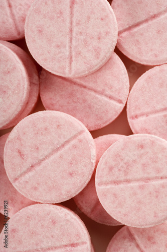 a frame full of pink pills
