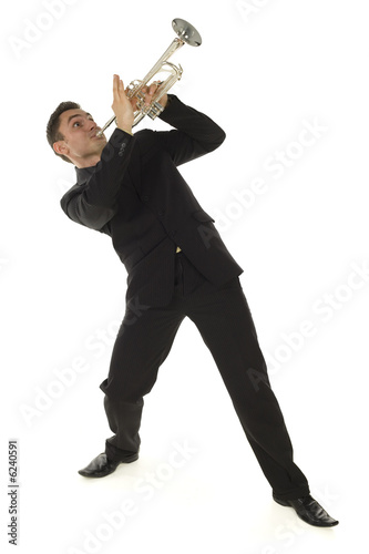 Man in suit standing and trumpet melody. Whole body